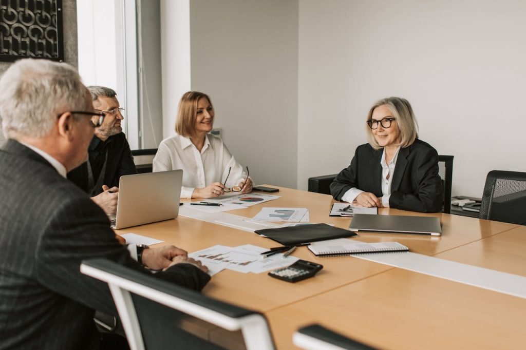 Diverse group of professionals engaged in an office strategy meeting.